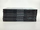 five star wars books stacked on top of each other on a table