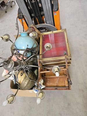 a pile of assorted items sitting on the floor