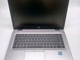 a laptop that is sitting on a white table