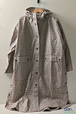 an image of a brown and white coat hanging on a wall