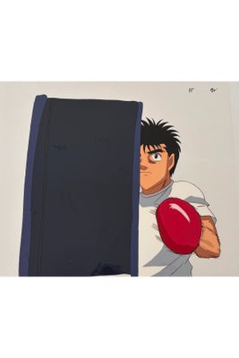 cartoon of a man holding a red ball in front of a wall