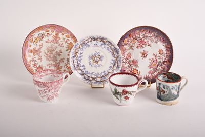 many different types of plates and cups on the table