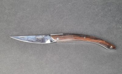 a knife that is laying on top of a table