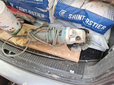 the trunk of a car with a bunch of items inside of it