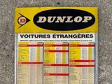 yellow and black sign on the wall of a store advertising a lot of votures etrangeress