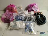 many bags of items that are sitting on the floor