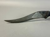 a knife that is sitting on a table