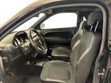 the interior of a car with the door open and the driver ' s seat up