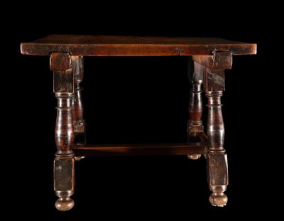 an old wooden table with two legs and a wooden top