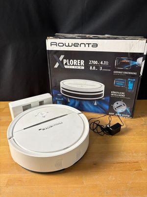 the box is open on the table next to the box of the router