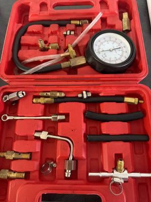 an image of a red case with tools in it on a table