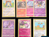several pokemon cards are displayed on a black surface
