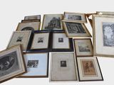 a lot of framed pictures on the table