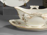 a gravy dish with a bow on the side