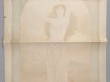 an old photo of a woman standing in front of a painting