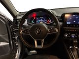 a picture of the interior of a car with a steering wheel