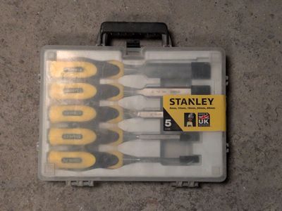 six screwdrivers in a plastic case on the floor
