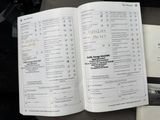 a book open to a list of items on a table