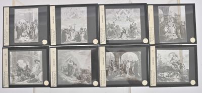 nine framed pictures of a religious scene on the wall