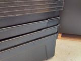 a stack of metal containers sitting on the floor