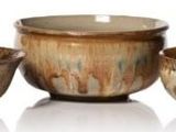 three bowls sitting next to each other on a white surface