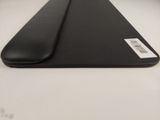 a close up of a black laptop case on a white surface