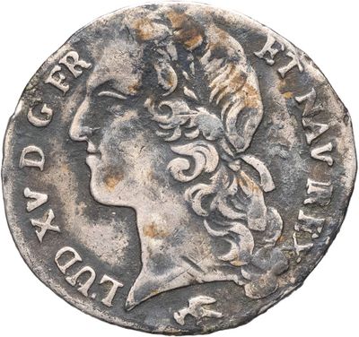 une pièce d'argent portant l'image d'une tête de femme
