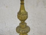 antique brass candle holder with three candles on top of each other
