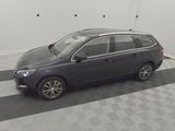 a picture of a grey car parked in a garage