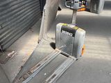 a fork lifter that is sitting on the ground