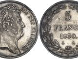 a silver coin with the image of a woman in profile