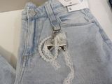 a picture of a pair of jeans with a bow on it