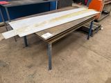 a table that has a piece of wood on top of it