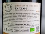 a bottle of wine on a table with a label on it