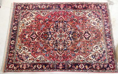a close up of an oriental rug on a white surface
