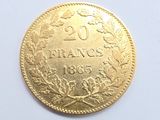 l'image d'une pièce d'or sur laquelle figure le chiffre 20