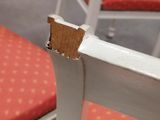 a piece of cardboard sticking out of the back of a chair