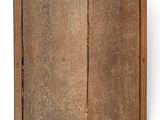 an old wooden frame with a window on a white wall