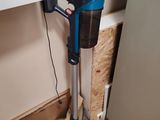a vacuum that is sitting on the floor next to a box