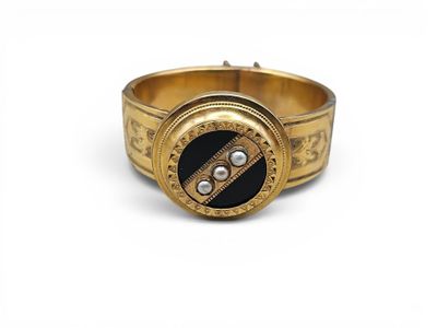 an image of a close up of a gold bracelet with a clock on it