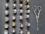a lot of different types of metal objects on the table