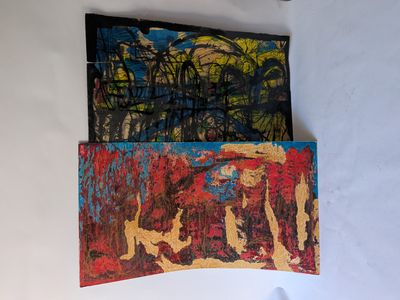 two paintings hanging on the wall next to each other