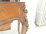 a wooden table with a mirror on top of it