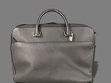 an image of a silver briefcase on a gray background