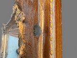 a mirror that is hanging on the wall in the room