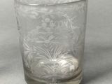 an image of a clear glass with a flower design on it