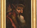 un vieux tableau représentant un homme barbu, dans un cadre doré
