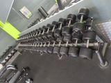 a rack of dumbs and weights in a gym room