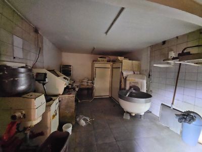 an image of a kitchen with a lot of pots and pans