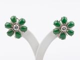 a pair of green jade and diamond flower earrings